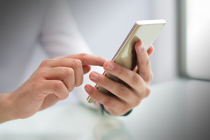 Man using smartphone.